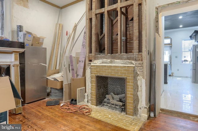 228 Cumberland St, Lebanon, PA 17042 - interior space featuring visible vents, ornamental molding, wood finished floors, recessed lighting, and a brick fireplace