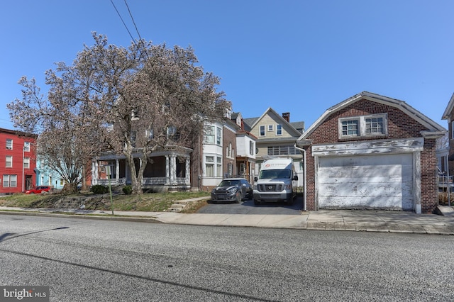 228 Cumberland St, Lebanon, PA 17042 - view of front of house featuring a detached garage and brick siding
