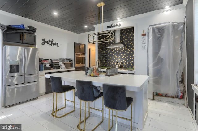 228 Cumberland St, Lebanon, PA 17042 - kitchen featuring a kitchen bar, light countertops, wooden ceiling, appliances with stainless steel finishes, and wall chimney exhaust hood
