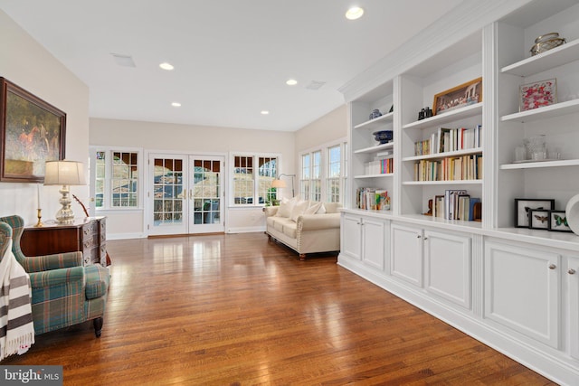 sitting room with dark wood finished floors, recessed lighting, baseboards, and french doors