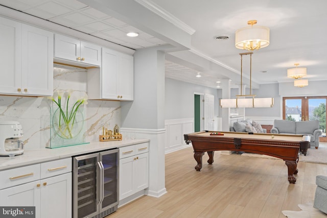 rec room with visible vents, a wainscoted wall, billiards, wine cooler, and light wood finished floors