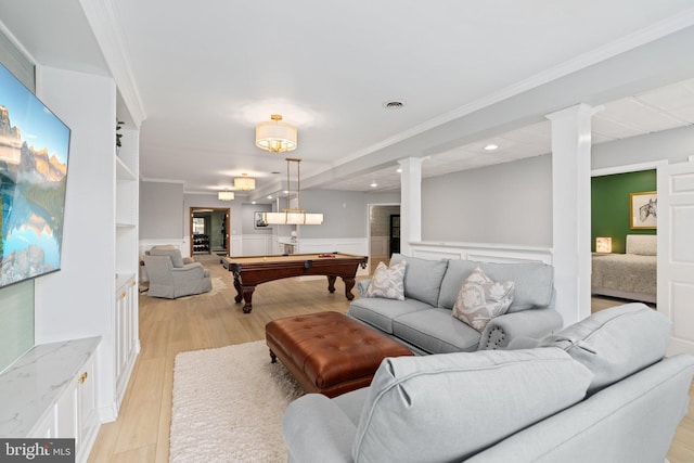 playroom with billiards, light wood-style floors, ornamental molding, and wainscoting