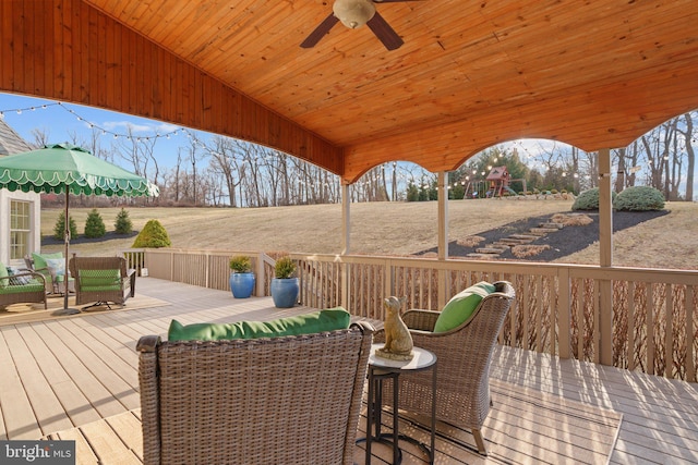 wooden terrace featuring ceiling fan