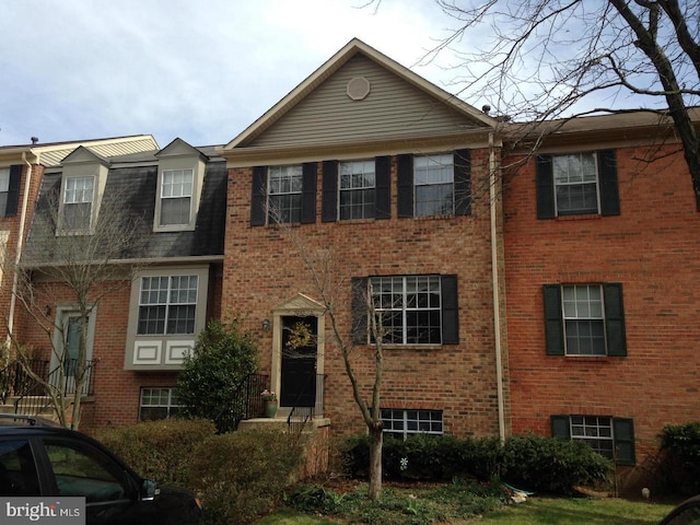 multi unit property featuring brick siding