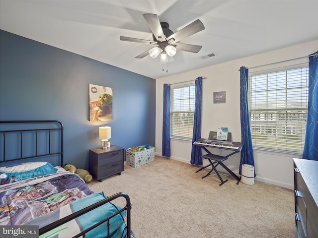 bedroom featuring baseboards, visible vents, and carpet floors