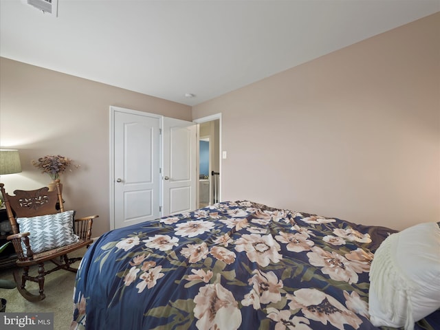 carpeted bedroom with visible vents