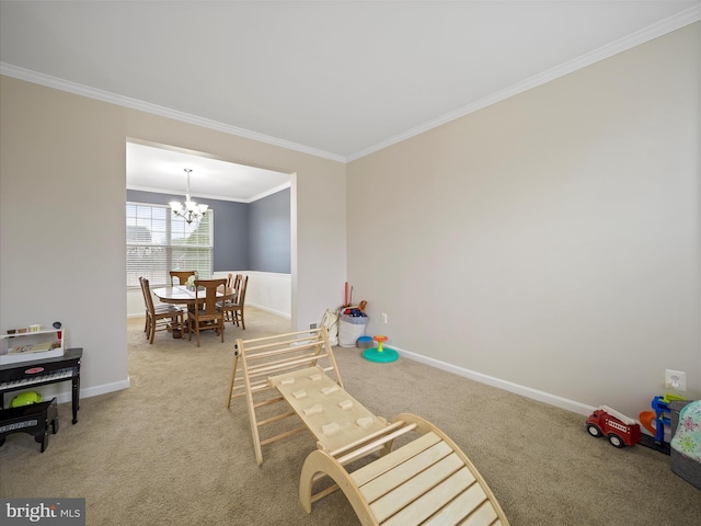 playroom with an inviting chandelier, baseboards, carpet floors, and ornamental molding