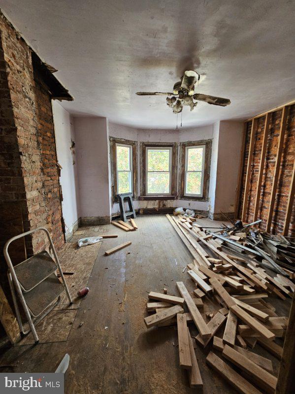 interior space featuring ceiling fan