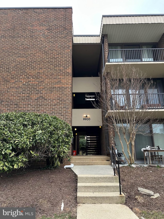 view of building exterior with stairs