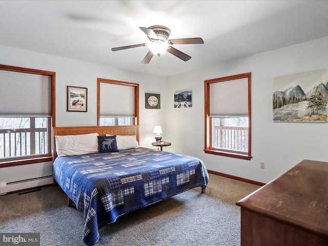 carpeted bedroom featuring ceiling fan, a baseboard heating unit, and baseboards