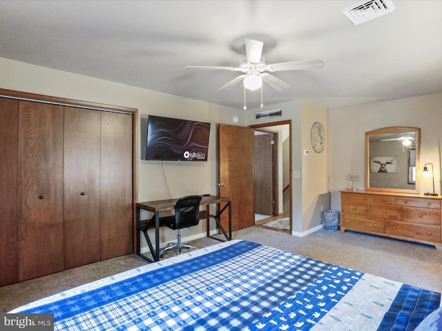 bedroom featuring a ceiling fan, baseboards, visible vents, a closet, and carpet flooring