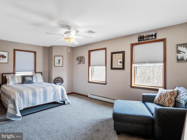 carpeted bedroom with a ceiling fan, baseboards, visible vents, and baseboard heating