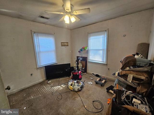 bedroom with carpet, baseboards, visible vents, and a ceiling fan