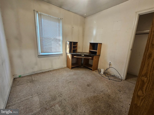 unfurnished bedroom featuring carpet