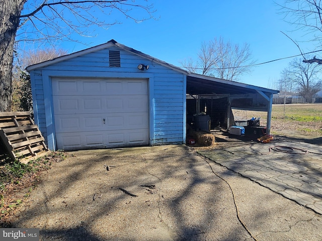 detached garage with aphalt driveway