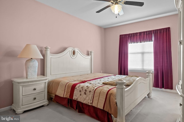 bedroom with baseboards, ceiling fan, and carpet floors