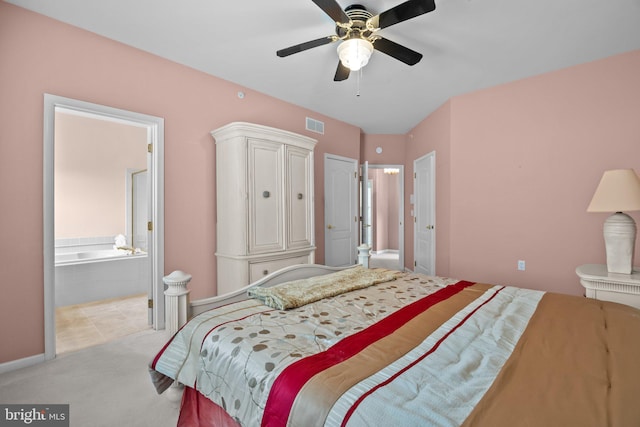 carpeted bedroom featuring ceiling fan, visible vents, and connected bathroom