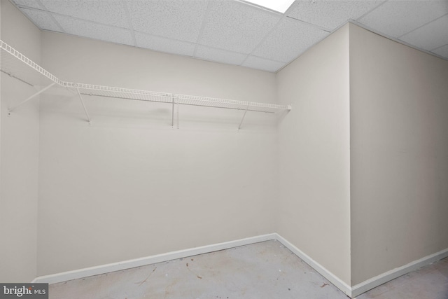 walk in closet with a paneled ceiling