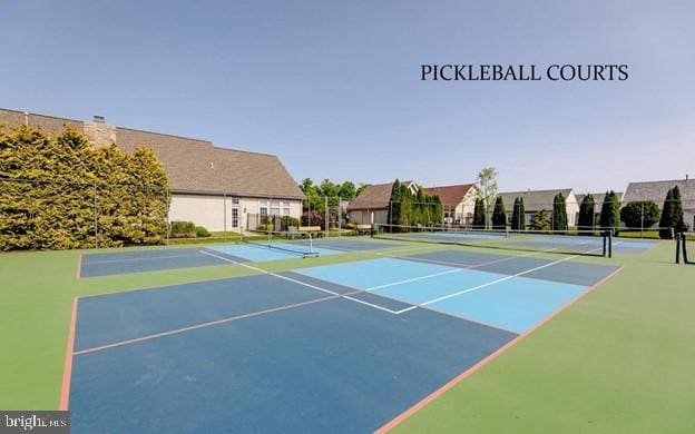 view of sport court with community basketball court and fence