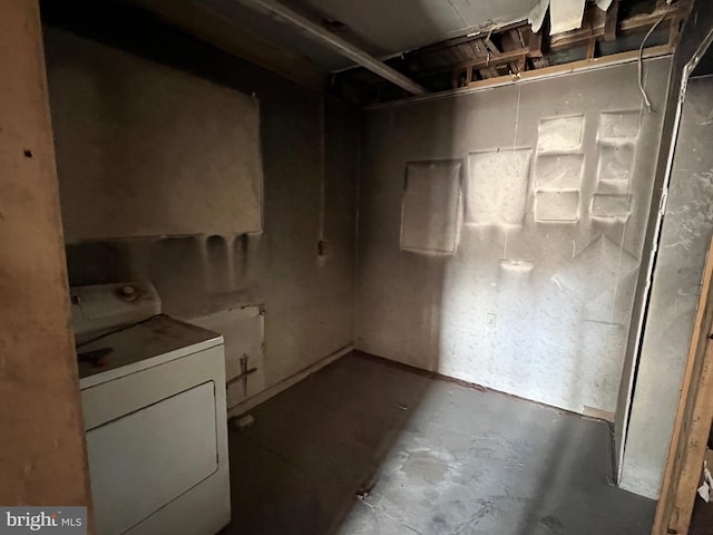 unfinished below grade area with washer / clothes dryer