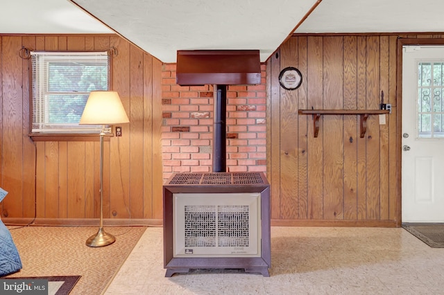 381 N Main St, Spring Grove, PA 17362 - foyer featuring wood walls, baseboards, tile patterned floors, and a wood stove