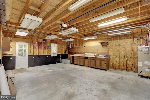 381 N Main St, Spring Grove, PA 17362 - garage featuring a garage door opener and a workshop area