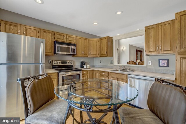 12521 N Lake Ct, Fairfax, VA 22033 - kitchen with a sink, light countertops, recessed lighting, and stainless steel appliances