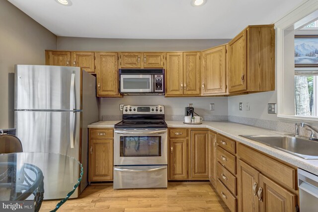 12521 N Lake Ct, Fairfax, VA 22033 - kitchen with light countertops, appliances with stainless steel finishes, and a sink