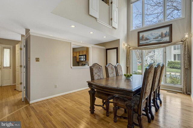 12521 N Lake Ct, Fairfax, VA 22033 - dining area with light wood-style flooring, baseboards, and visible vents