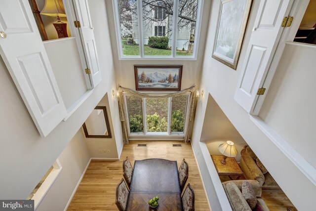 12521 N Lake Ct, Fairfax, VA 22033 - interior space with visible vents, baseboards, a high ceiling, and wood finished floors