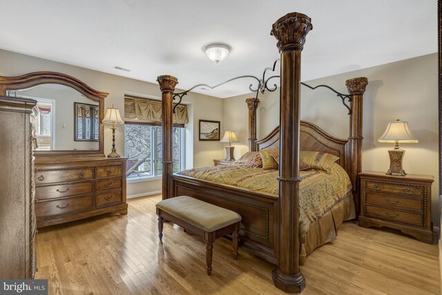12521 N Lake Ct, Fairfax, VA 22033 - bedroom with light wood-type flooring and visible vents