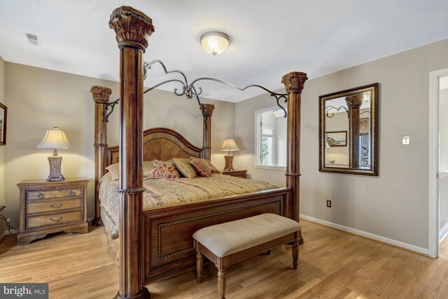 12521 N Lake Ct, Fairfax, VA 22033 - bedroom featuring visible vents, light wood-style flooring, and baseboards