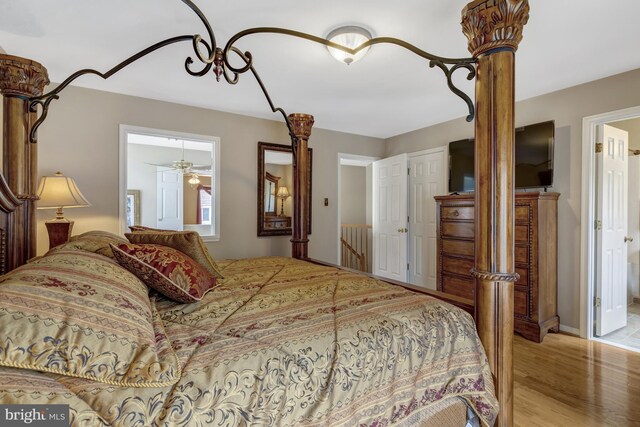 12521 N Lake Ct, Fairfax, VA 22033 - bedroom with connected bathroom and wood finished floors