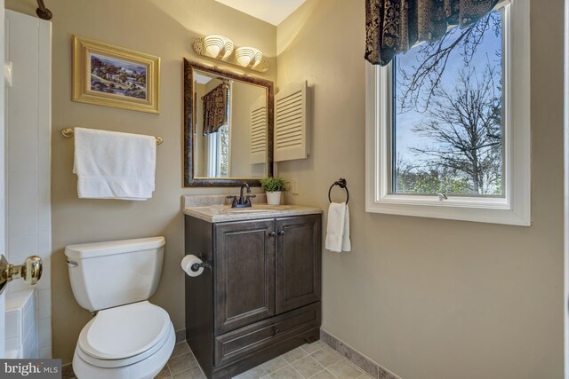 12521 N Lake Ct, Fairfax, VA 22033 - bathroom with vanity, a shower with curtain, tile patterned flooring, toilet, and baseboards
