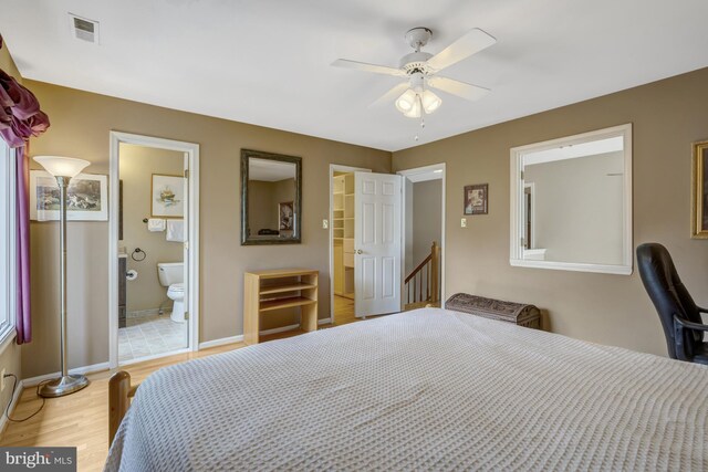 12521 N Lake Ct, Fairfax, VA 22033 - bedroom featuring ceiling fan, connected bathroom, light wood-style flooring, visible vents, and baseboards