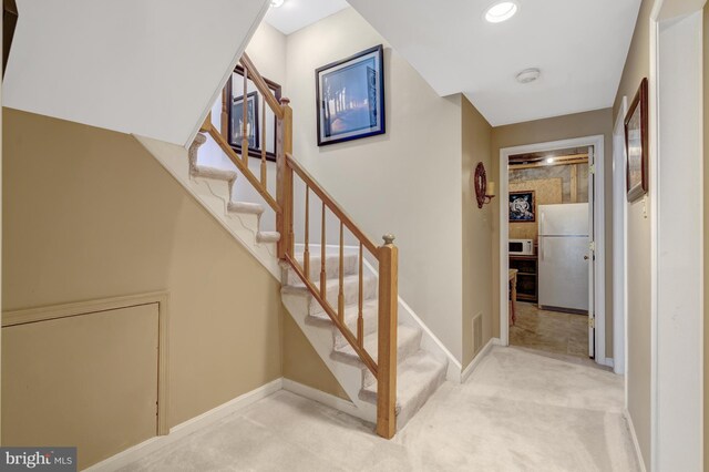 12521 N Lake Ct, Fairfax, VA 22033 - stairway with carpet, visible vents, and baseboards