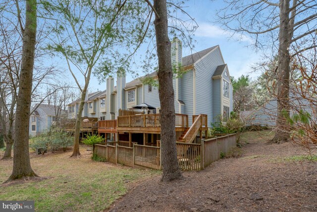 12521 N Lake Ct, Fairfax, VA 22033 - rear view of property with a chimney, a wooden deck, and a residential view