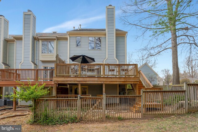 12521 N Lake Ct, Fairfax, VA 22033 - rear view of house with cooling unit, a chimney, a wooden deck, and stairway