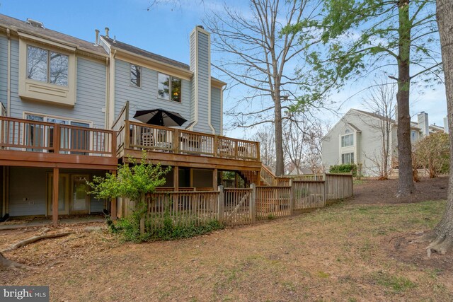 12521 N Lake Ct, Fairfax, VA 22033 - rear view of house featuring a wooden deck, stairway, and a chimney