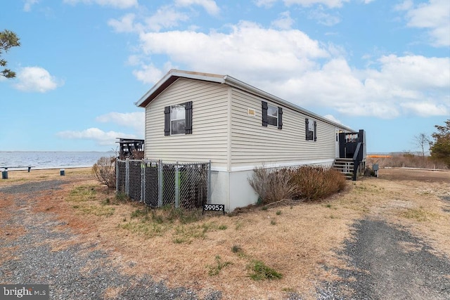 39952 Summers End Rd Unit 7244, Fenwick Island, DE 19944 - view of side of home with a water view