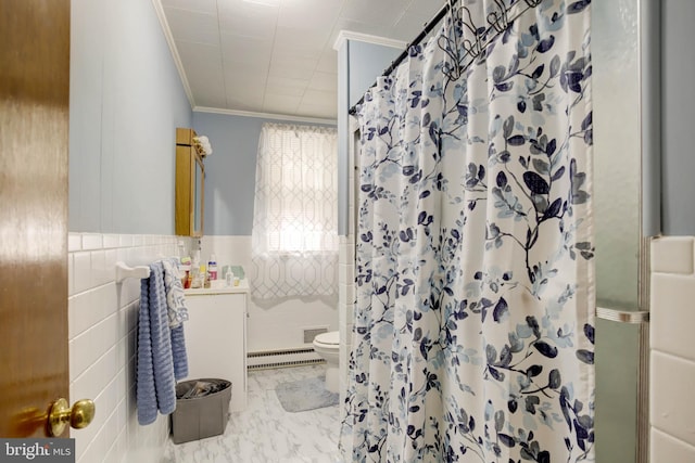 bathroom featuring toilet, a shower with shower curtain, ornamental molding, marble finish floor, and tile walls