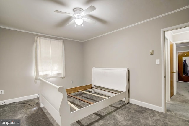 unfurnished bedroom with baseboards, carpet, ceiling fan, and crown molding