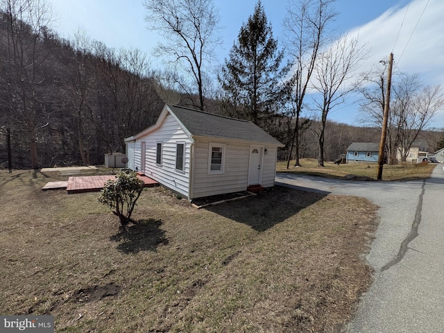 view of outbuilding featuring driveway