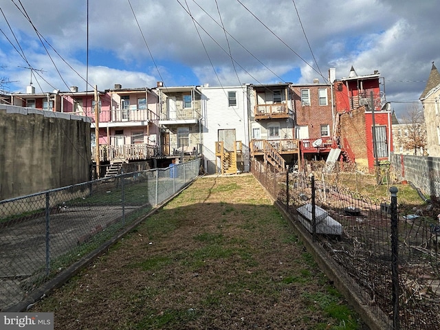 view of yard featuring a residential view and fence private yard