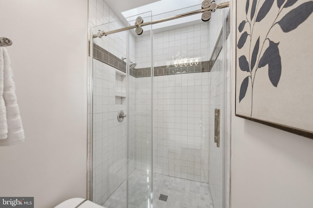 full bath with a shower stall and toilet