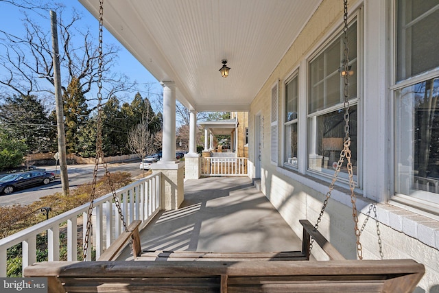 wooden deck featuring covered porch