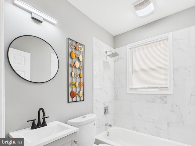 bathroom featuring bathtub / shower combination, toilet, and vanity