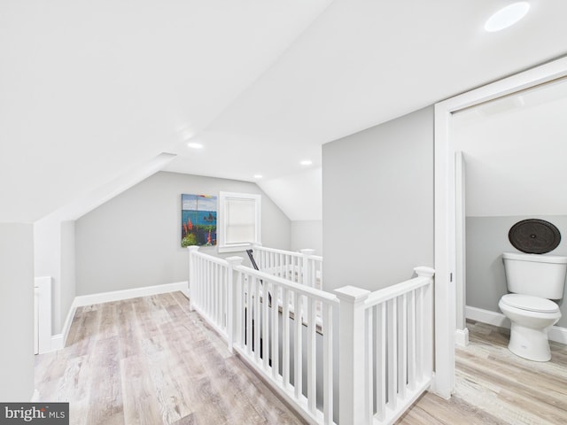 additional living space featuring vaulted ceiling, recessed lighting, baseboards, and wood finished floors