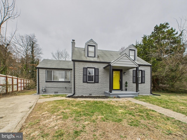 new england style home with a front yard, fence, crawl space, and a chimney