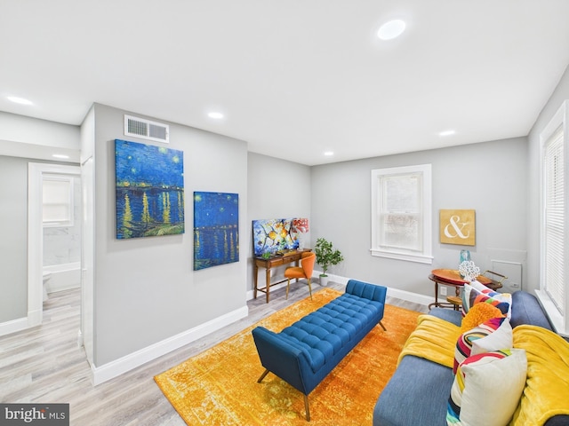 interior space with visible vents, recessed lighting, baseboards, and wood finished floors